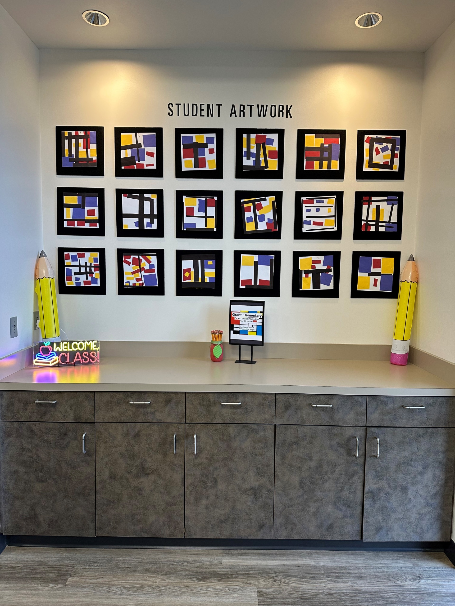 Grant Elementary Student Artwork Wall Student artwork wall in the Teacher Store displaying artwork made by local K-12 students.